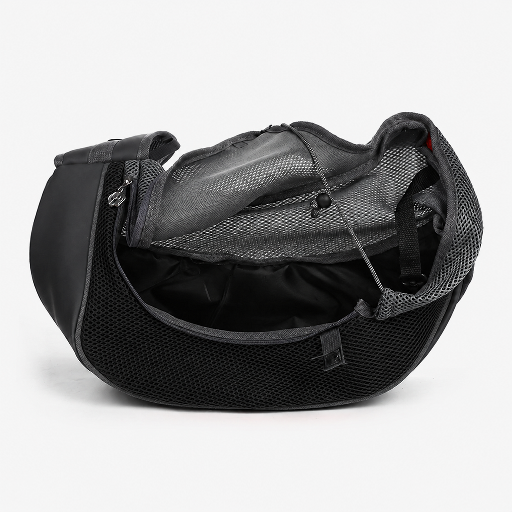 Sac bandoulière Le Baladin noir ouvert, doublure intérieure et cordon de serrage visibles — maille respirante pour petit chien